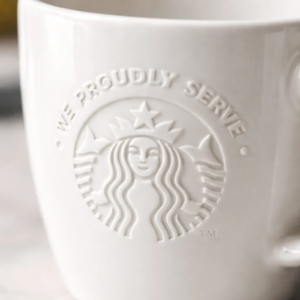 Taza Blanca Cerámica Starbucks frase "We Proudly Serve"